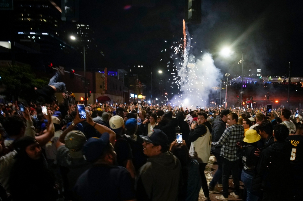 People celebrate the Nuggets' historic win.